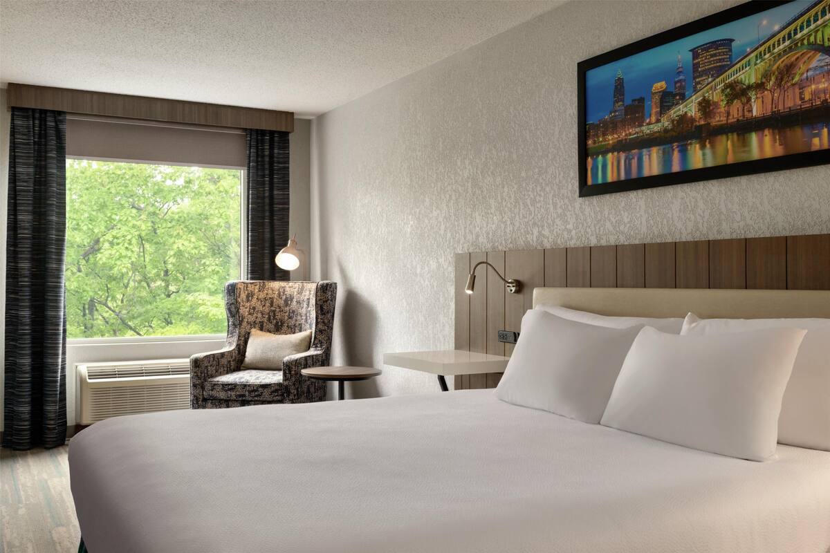 room | desk, blackout curtains, iron/ironing board, cots/infant beds