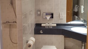 A modern bathroom with a shower, toilet, and sink. - Holiday Inn Express Birmingham - Castle Bromwich by IHG (Birmingham)