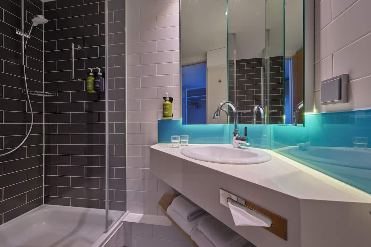 shower, eco-friendly toiletries, hair dryer, towels