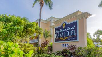 The exterior of Hutchinson Island Plaza Hotel with a sign indicating it offers suites.