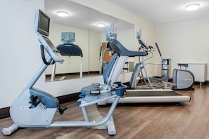 A gym with exercise equipment including treadmills and an elliptical machine. - Holiday Inn Express & Suites Harrison by IHG (Harrison)