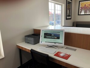 A desk with a desktop computer, a printer, and a keyboard. - Holiday Inn Express & Suites Harrison by IHG (Harrison)