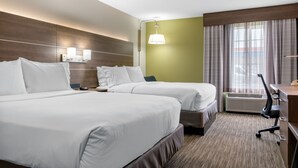 A hotel room with two beds, a desk, an air conditioner, and a window with curtains. - Holiday Inn Express & Suites Harrison by IHG (Harrison)
