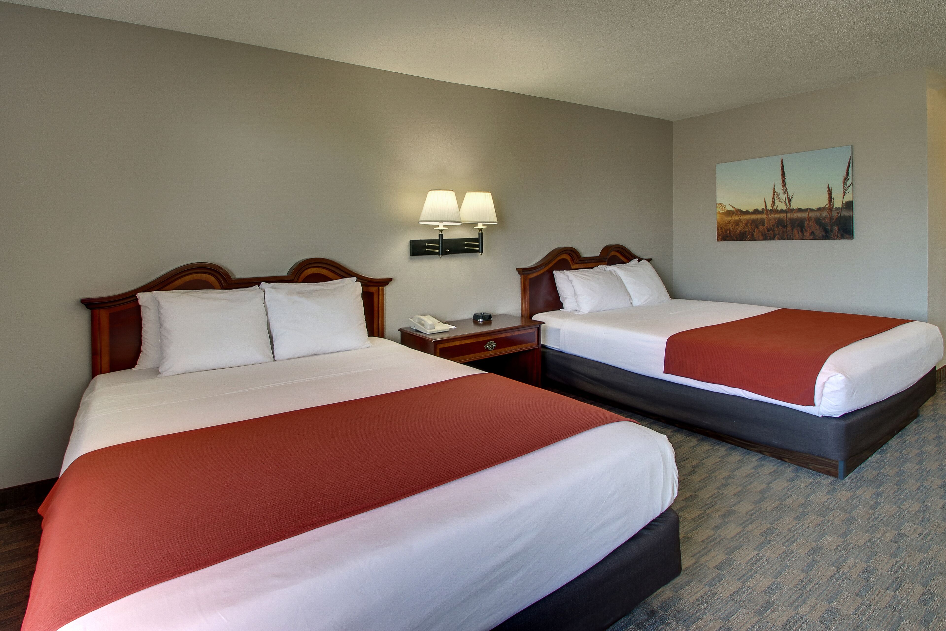 deluxe room, 2 queen beds (standard two queen room) | in-room safe, desk, iron/ironing board, free wifi