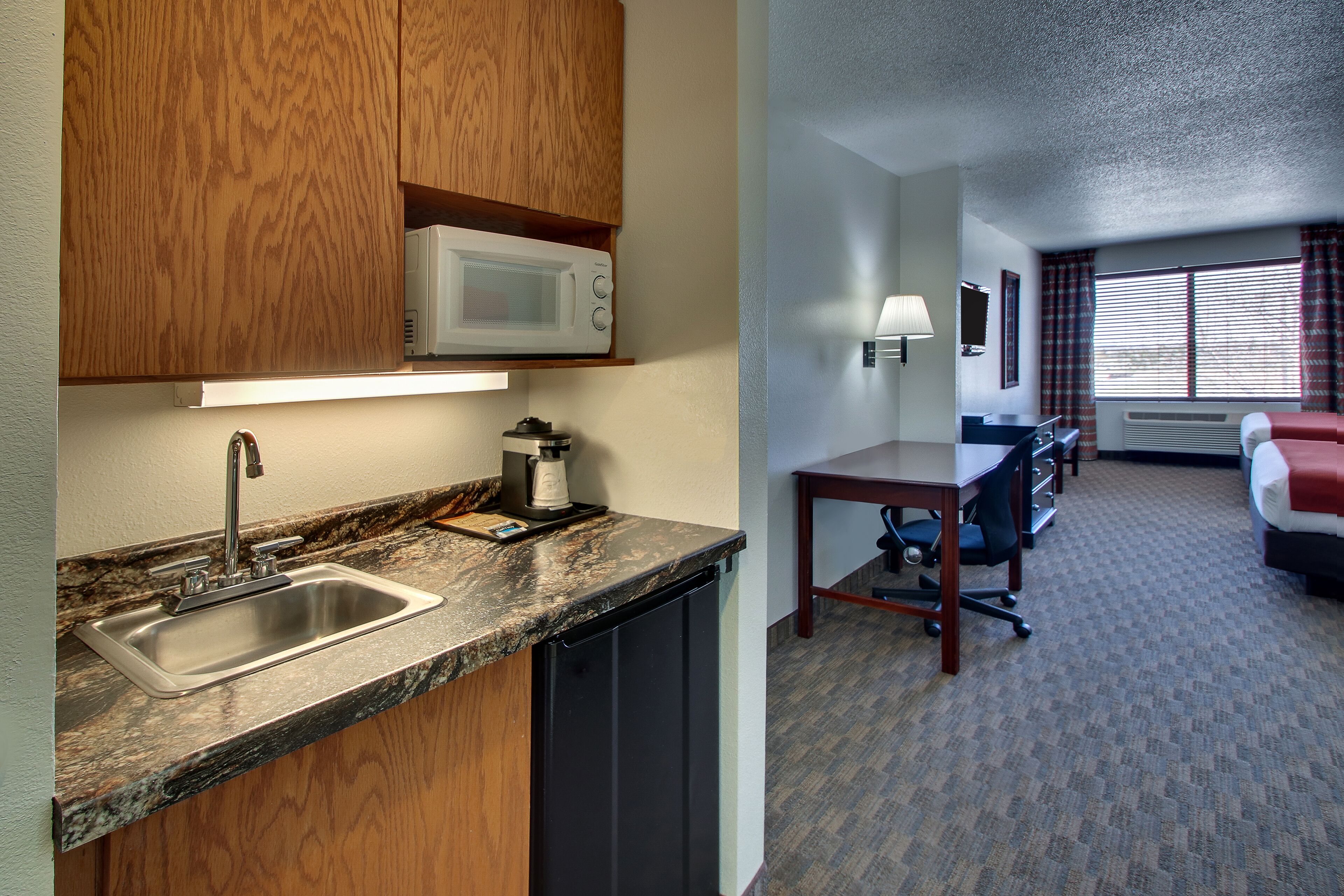 suite, 2 queen beds (two queen bedded suite) | in-room safe, desk, iron/ironing board, free wifi