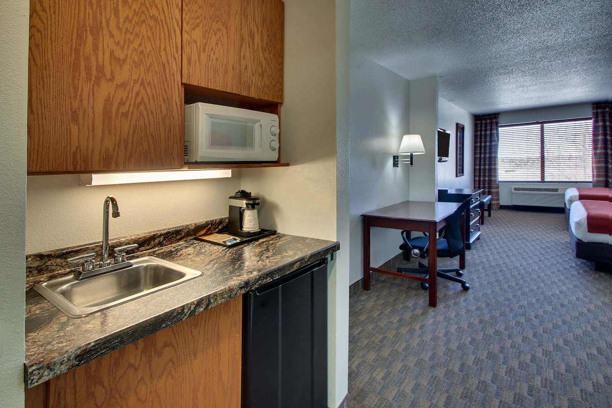 suite, 2 queen beds (two queen bedded suite) | in-room safe, desk, iron/ironing board, free wifi