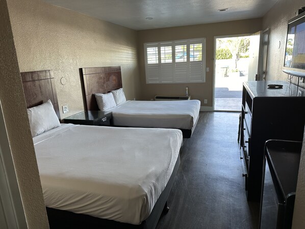 Room, 2 Queen Beds | Bathroom | Combined shower/bathtub, free toiletries, hair dryer, towels