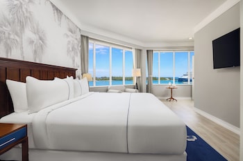 Premium Suite, Ocean View | Premium bedding, pillowtop beds, in-room safe, desk at British Colonial - Nassau 