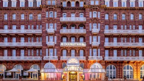 A multi-story building with a prominent "DoubleTree" sign, featuring a classic architectural style with ornate balconies and large windows. - DoubleTree by Hilton Brighton Metropole (Brighton)