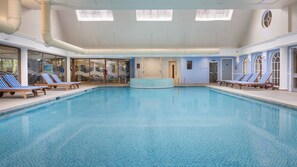 Indoor pool, open 6:00 AM to 9:30 PM, pool loungers