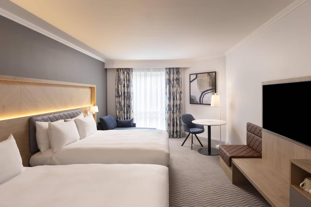 Deluxe Room, 2 Queen Beds | In-room safe, desk, laptop workspace, blackout drapes