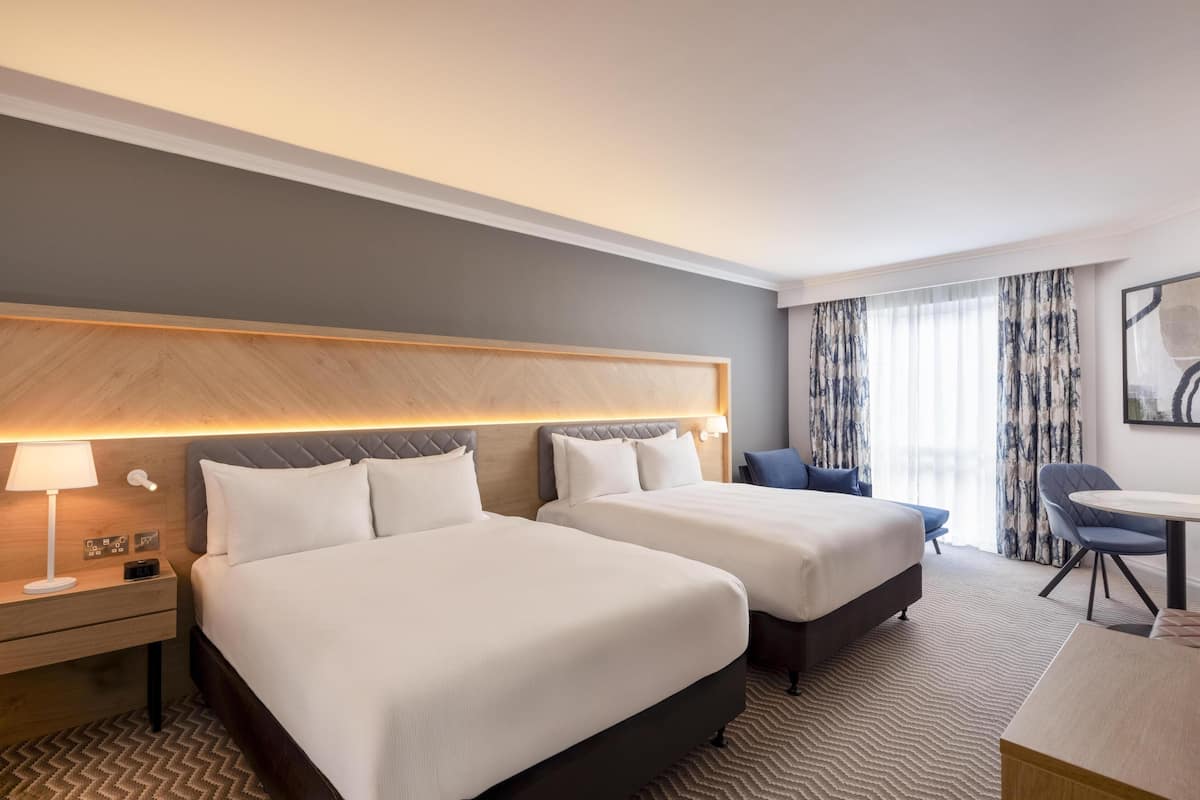 Deluxe Room, 2 Queen Beds | In-room safe, desk, laptop workspace, blackout drapes