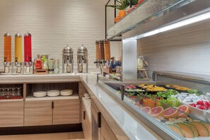 Enjoy a self-service buffet with a variety of fresh fruits and vegetables, along with a selection of beverages and condiments.