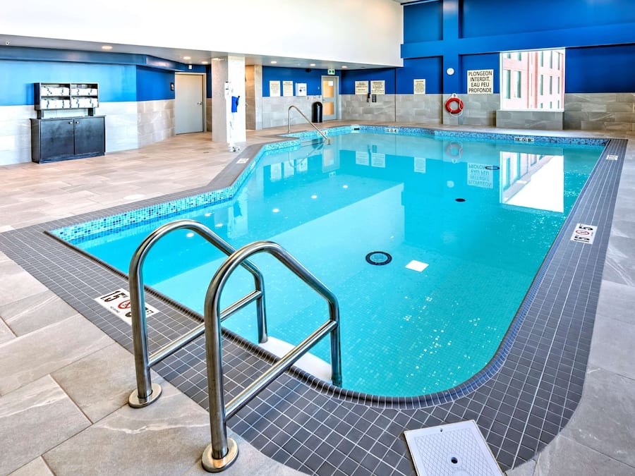 Indoor pool, open 6:00 AM to 11:00 PM, pool loungers