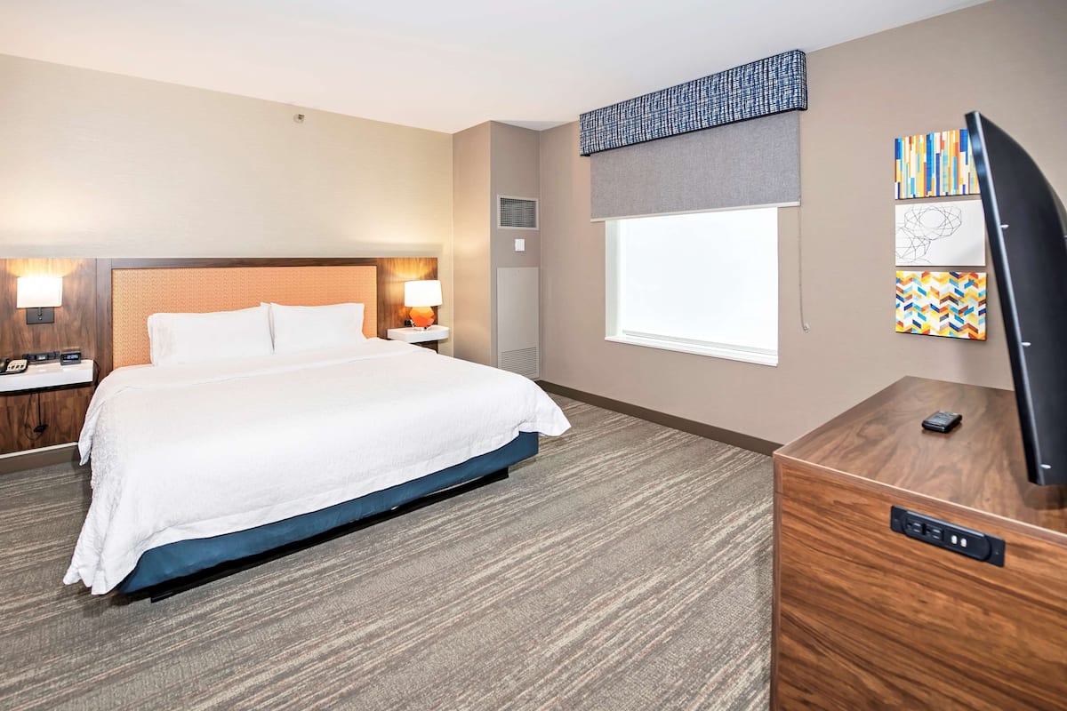 suite, 1 king bed, non smoking | premium bedding, desk, blackout curtains, iron/ironing board