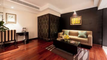 A modern living room with a sofa, coffee table, and decorative items.