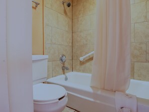 Combined shower/bathtub, deep-soaking bathtub, towels