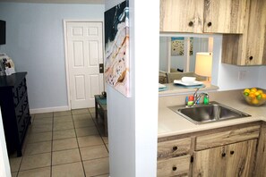 Suite, 1 Queen Bed, Kitchen | Private kitchen | Microwave, coffee/tea maker, cleaning supplies - The Bay Inn at Lani Kai (Fort Myers Beach)