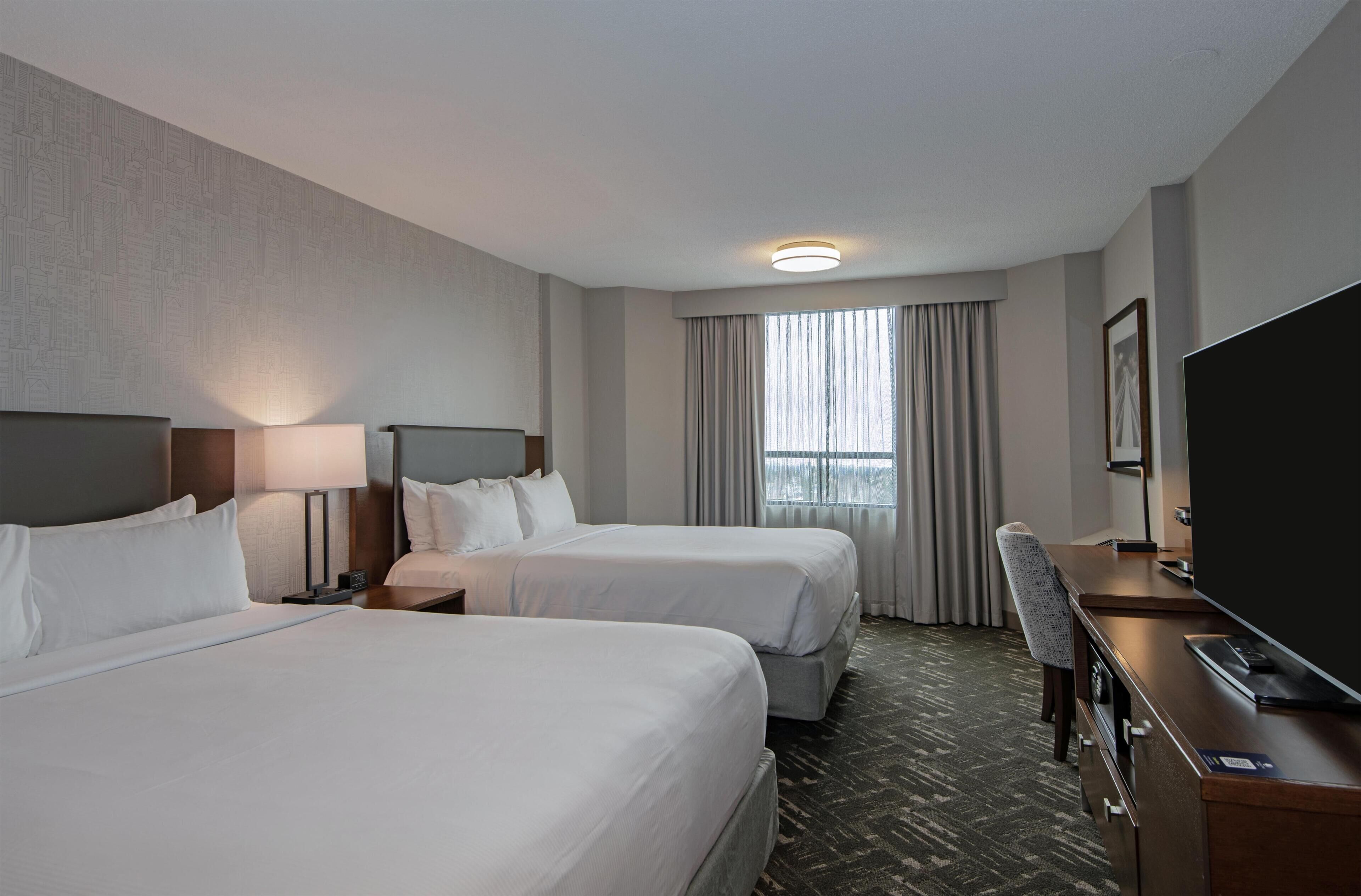 Room, 2 Queen Beds | In-room safe, iron/ironing board, free WiFi, bed sheets