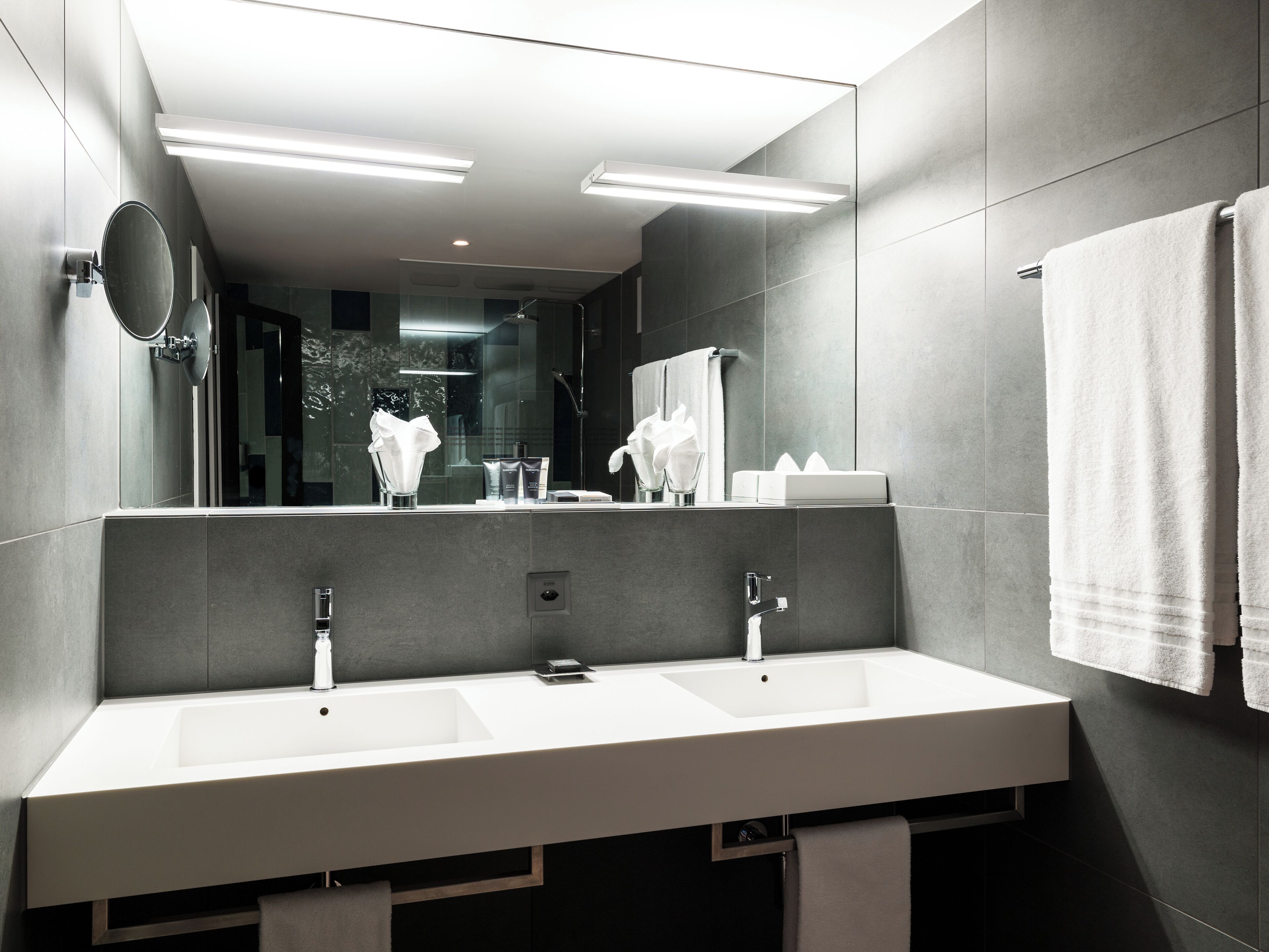 deep-soaking bathtub, designer toiletries, hair dryer, slippers