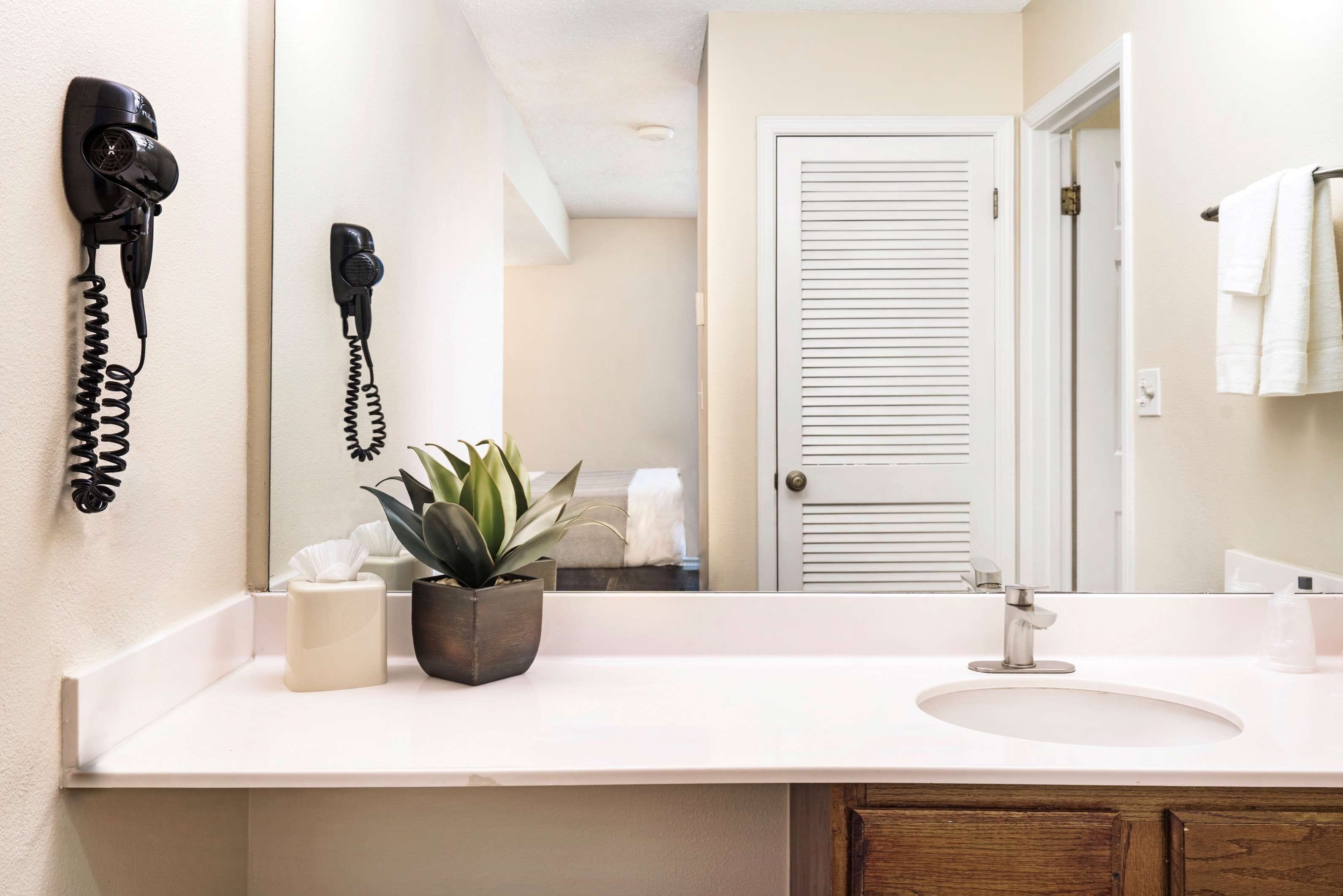 premium bedding, pillow-top beds, desk, laptop workspace