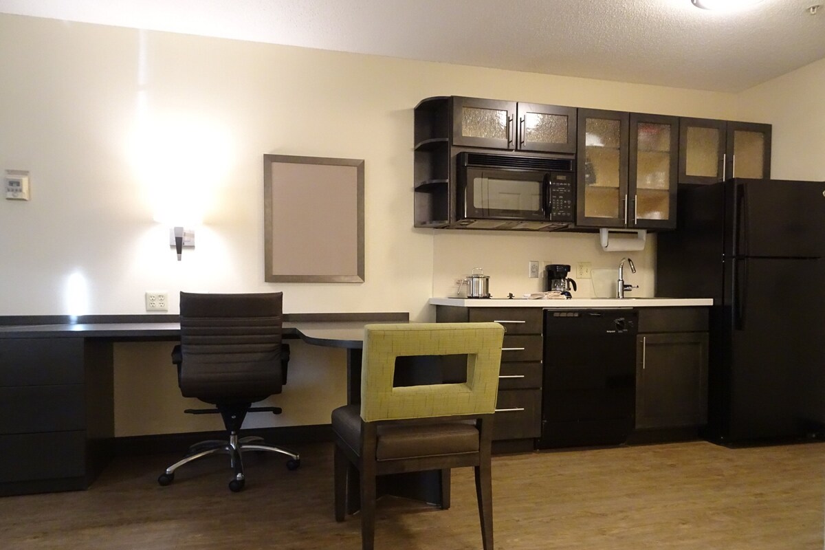 Desk, laptop workspace, blackout drapes, iron/ironing board