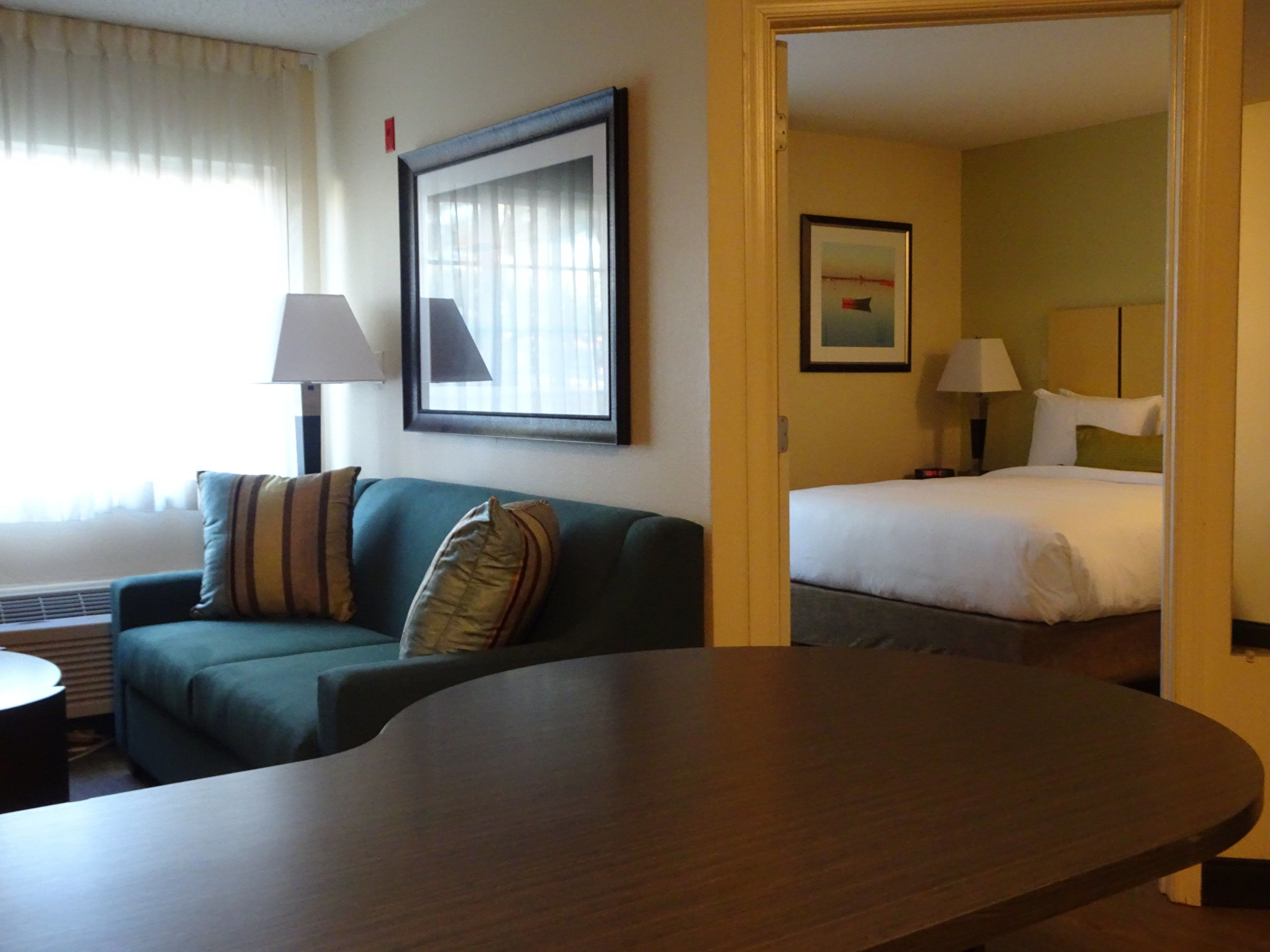 desk, laptop workspace, blackout curtains, iron/ironing board