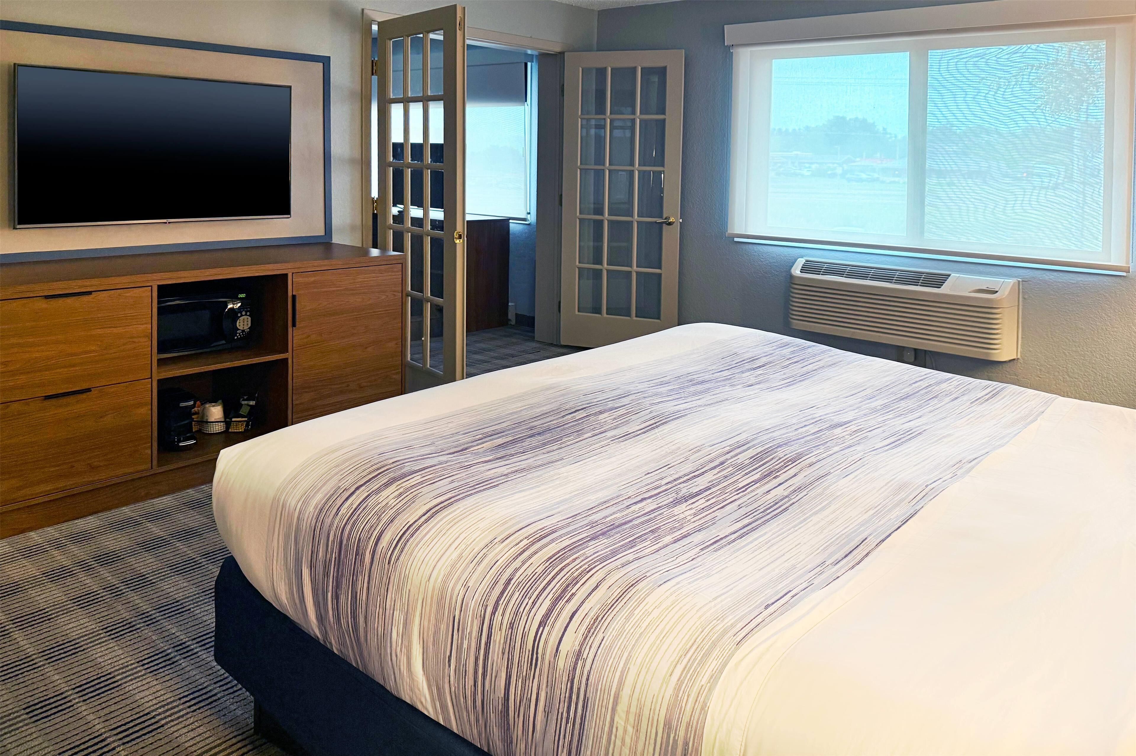 premier suite, 1 bedroom, non smoking (1 king bed) | pillow-top beds, desk, blackout curtains, iron/ironing board