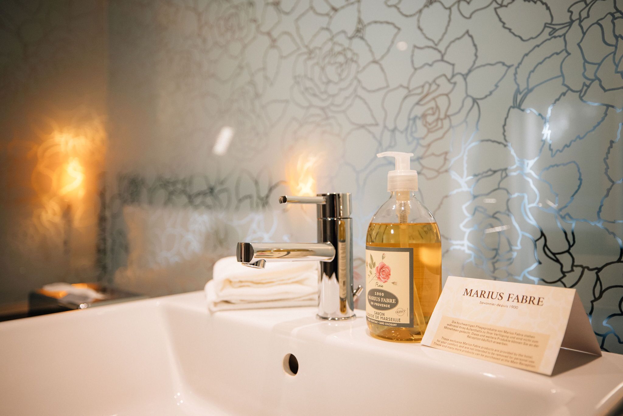 designer toiletries, hair dryer, bathrobes, slippers