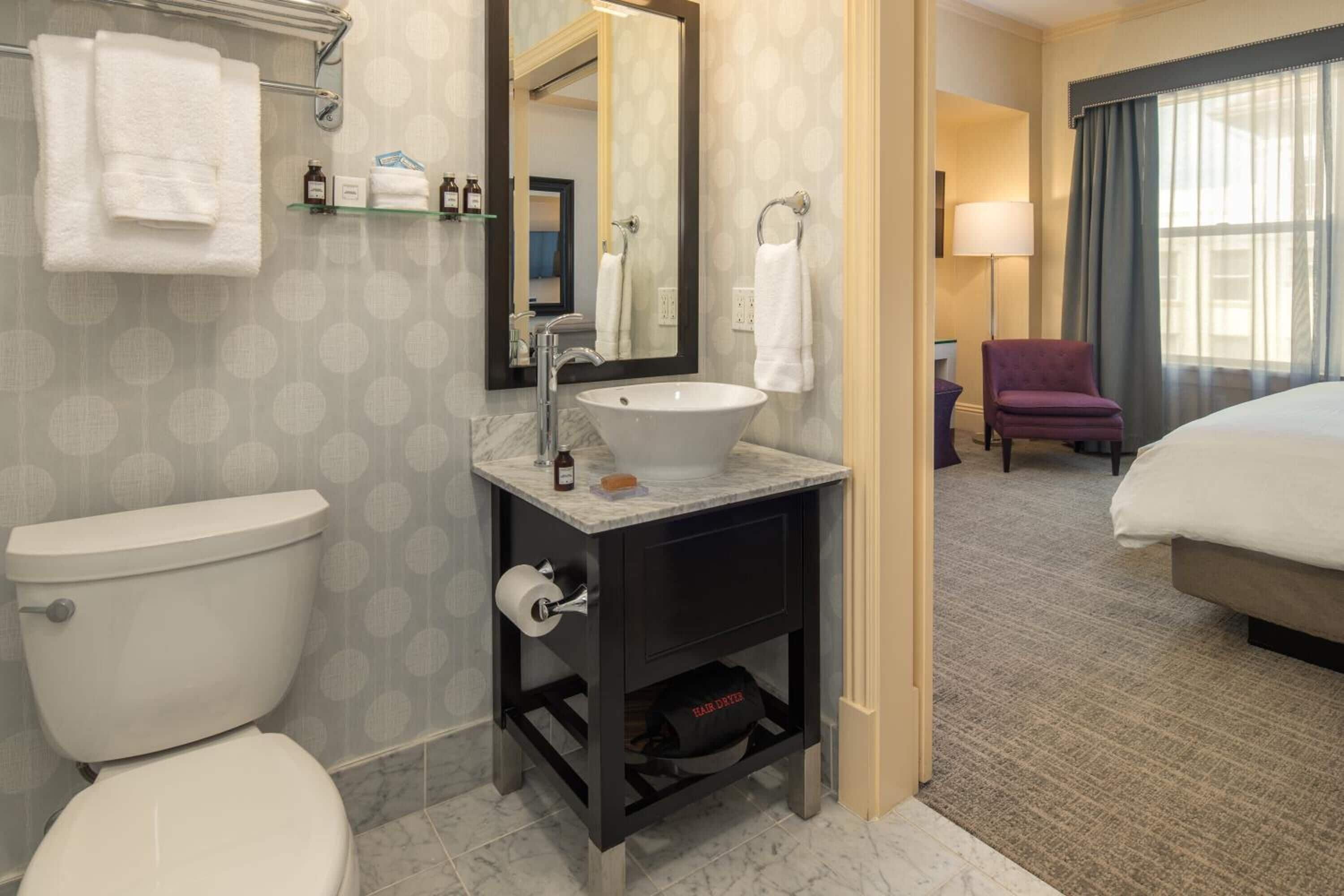 shower, designer toiletries, hair dryer, towels