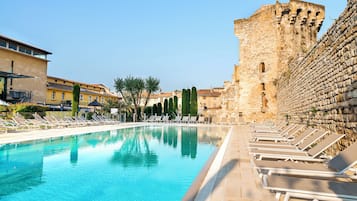 Seasonal outdoor pool, open 10:00 AM to 8:00 PM, pool umbrellas