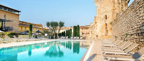 Seasonal outdoor pool, open 10:00 AM to 6:00 PM, pool umbrellas
