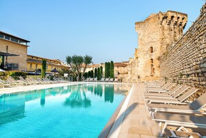 Seasonal outdoor pool, open 9:00 AM to 8:00 PM, pool umbrellas