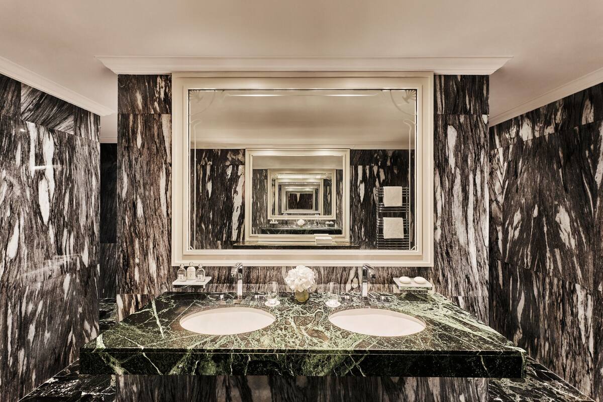 deep-soaking bathtub, hydromassage showerhead, bathrobes, slippers