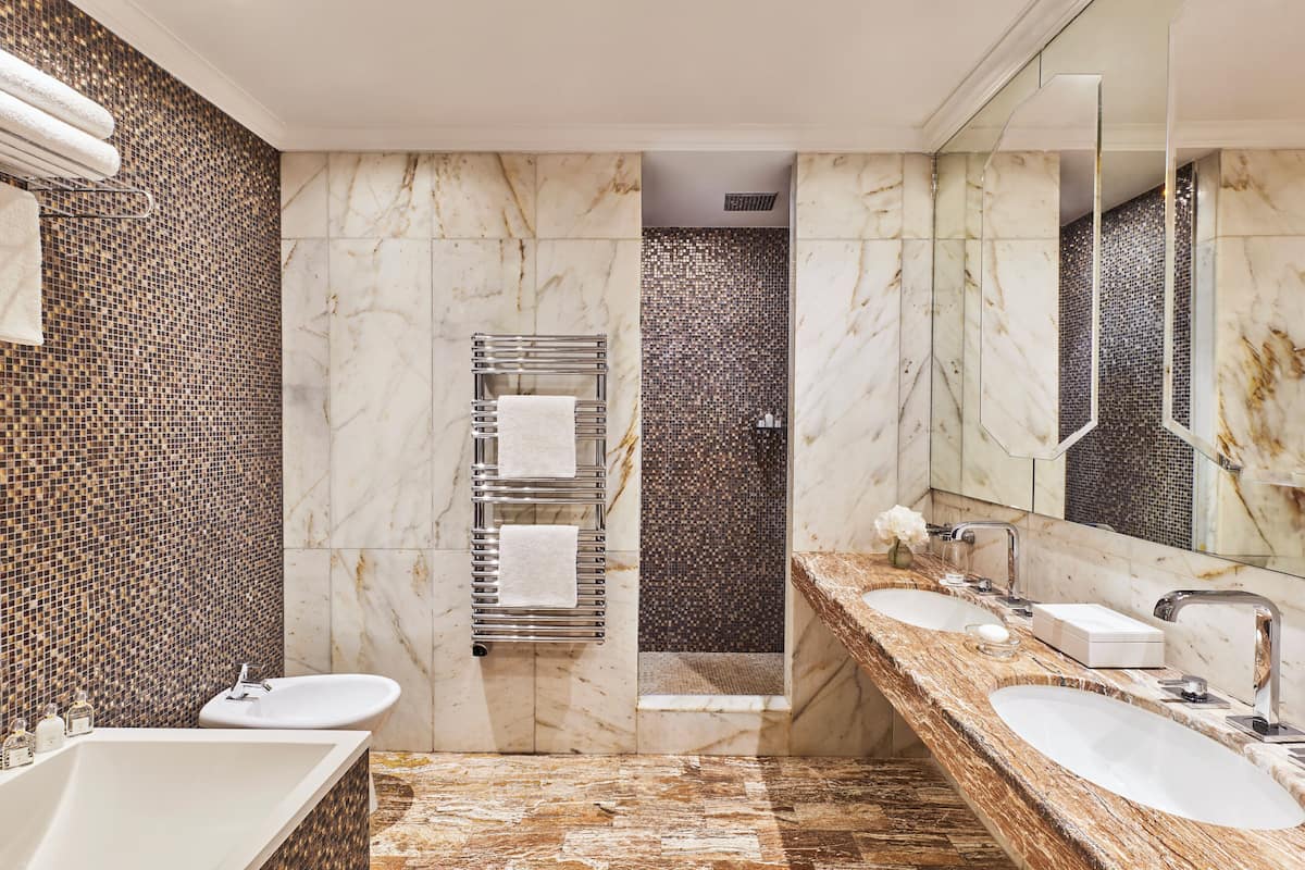 deep-soaking bathtub, hydromassage showerhead, bathrobes, slippers