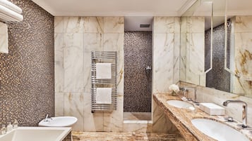 Deep soaking tub, hydromassage showerhead, bathrobes, slippers