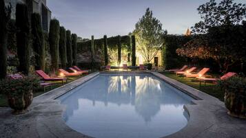 Seasonal outdoor pool, open 8:00 AM to 8:00 PM, pool umbrellas