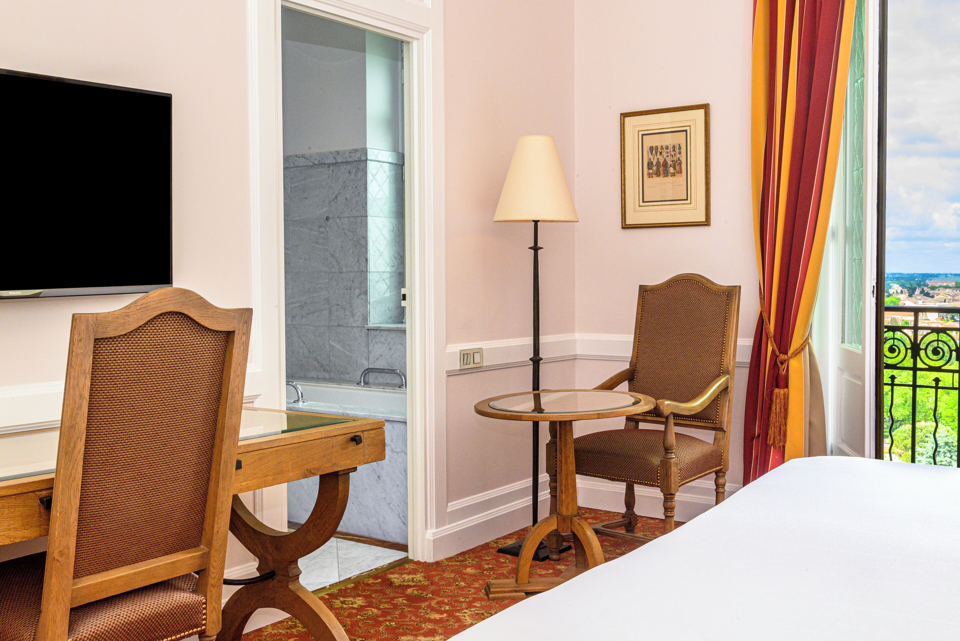 superior room overlooking the gardens and ramparts - a king-size bed | bathroom | eco-friendly toiletries, hair dryer, bathrobes, slippers