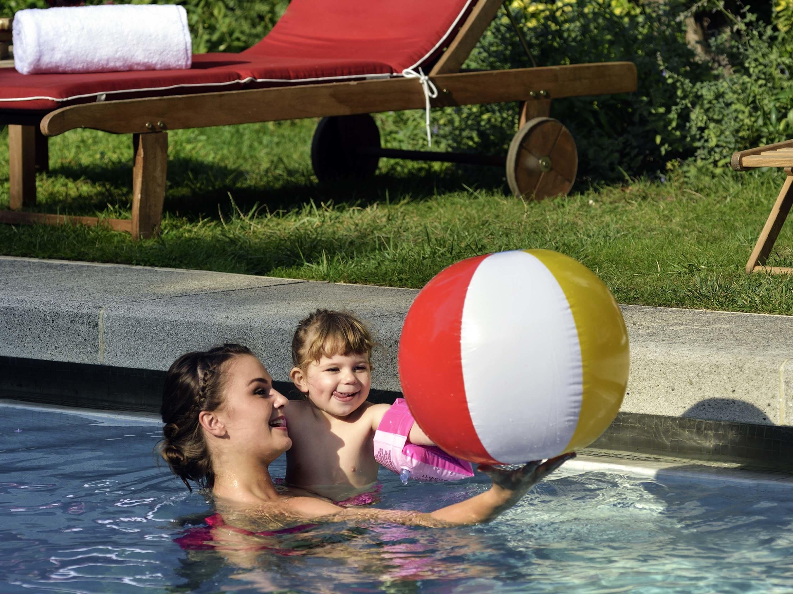 Seasonal outdoor pool, open 8:00 AM to 8:00 PM, pool umbrellas