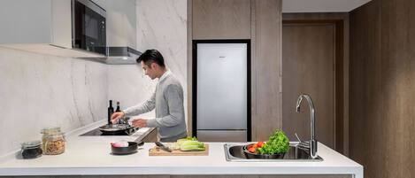 A modern kitchen with a central island, built-in appliances, and a sleek design.
