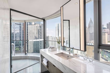 Separate tub and shower, rainfall showerhead, free toiletries