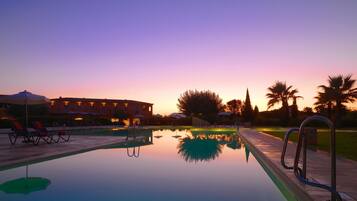 Indoor pool, seasonal outdoor pool, pool umbrellas, pool loungers