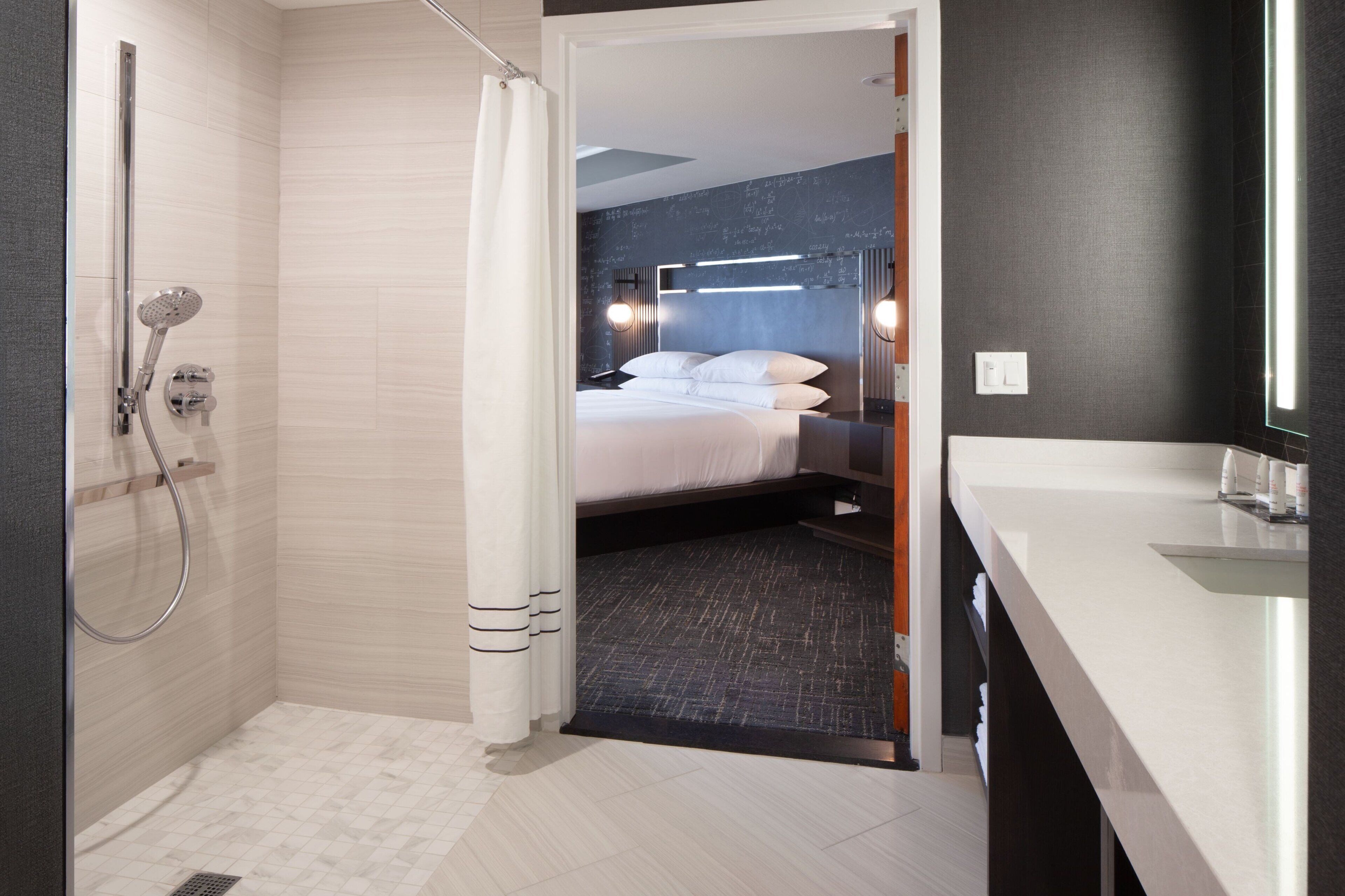 executive suite, 1 king bed with sofa bed | bathroom | combined shower/bathtub, free toiletries, hair dryer, towels