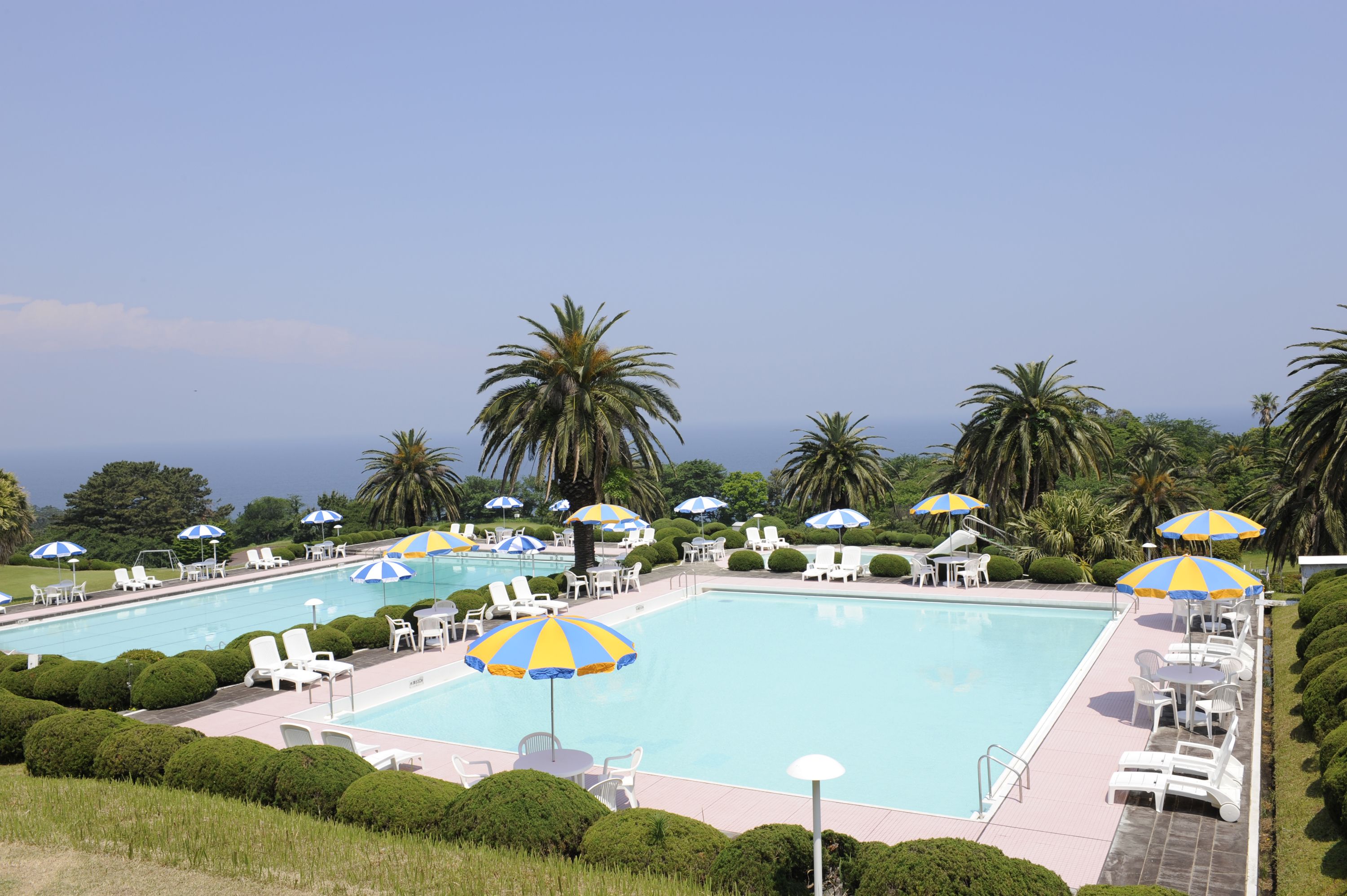 seasonal outdoor pool, open 9:00 am to 7:00 pm, pool umbrellas