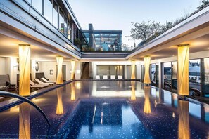 Indoor pool, open 7:00 AM to 8:00 PM, pool umbrellas, pool loungers