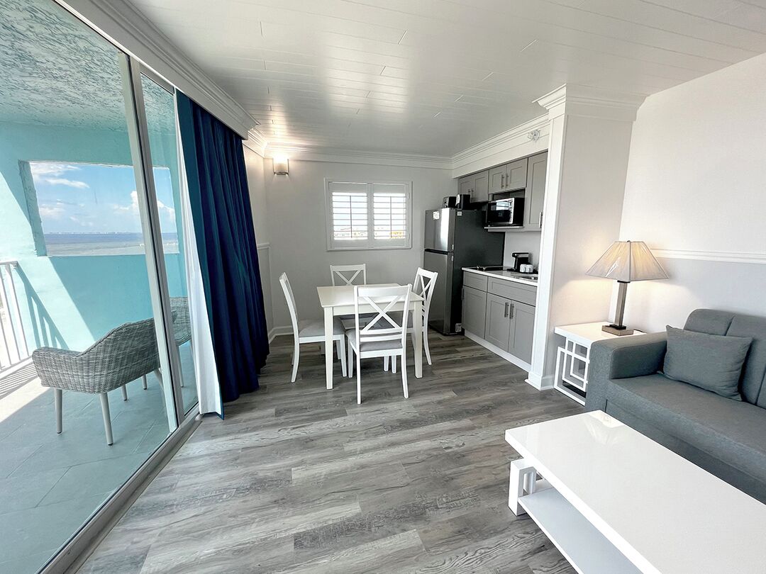 suite with king bed, beachfront, balcony | living area | flat-screen tv