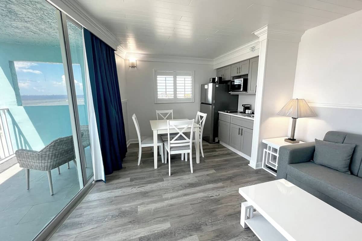 suite with king bed, beachfront, balcony | living area | flat-screen tv