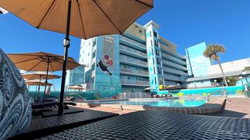 Outdoor pool, open 7:00 AM to 7:00 PM, pool umbrellas, sun loungers