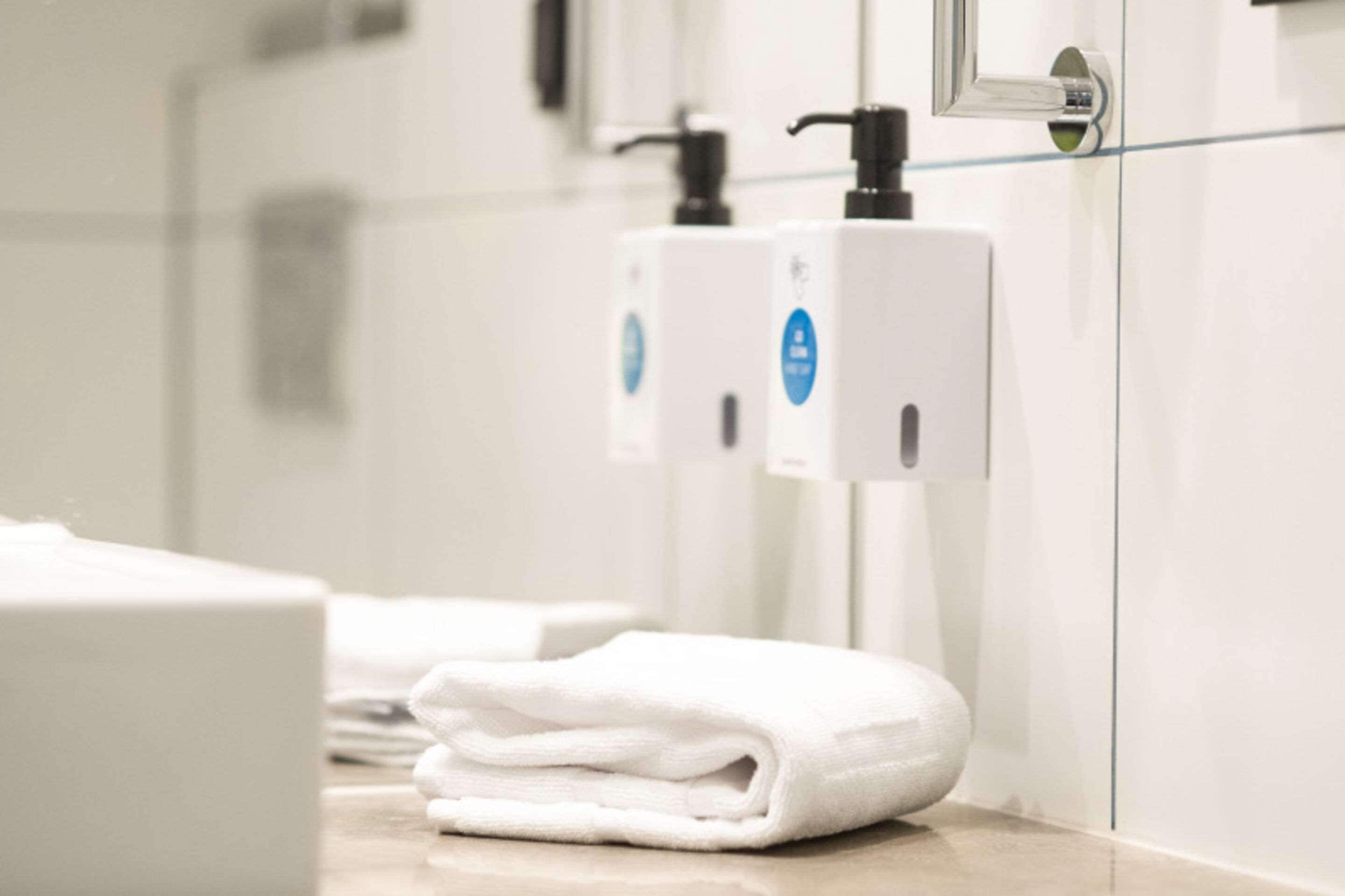 hypo-allergenic bedding, desk, laptop workspace, blackout curtains