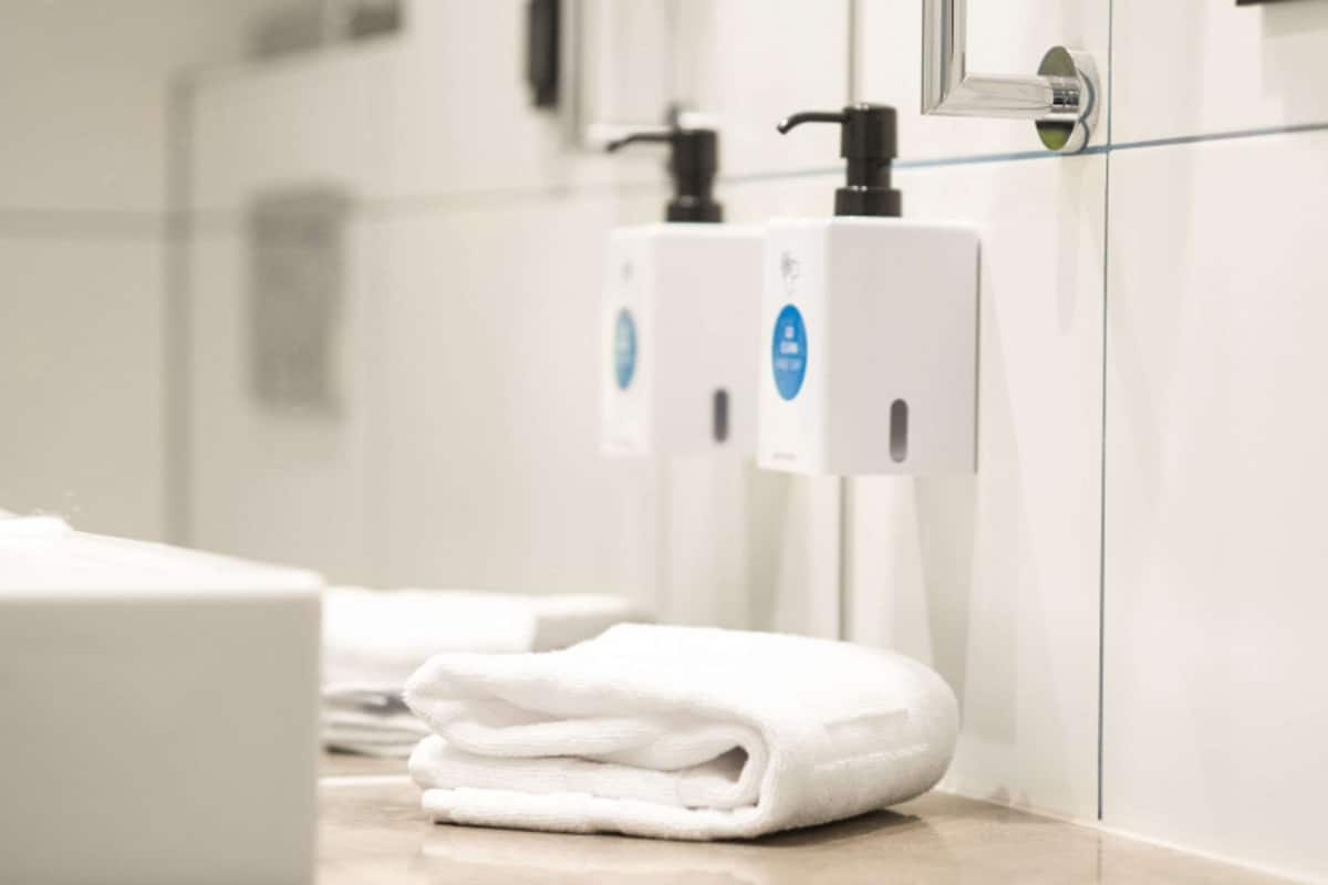 hypo-allergenic bedding, desk, laptop workspace, blackout curtains